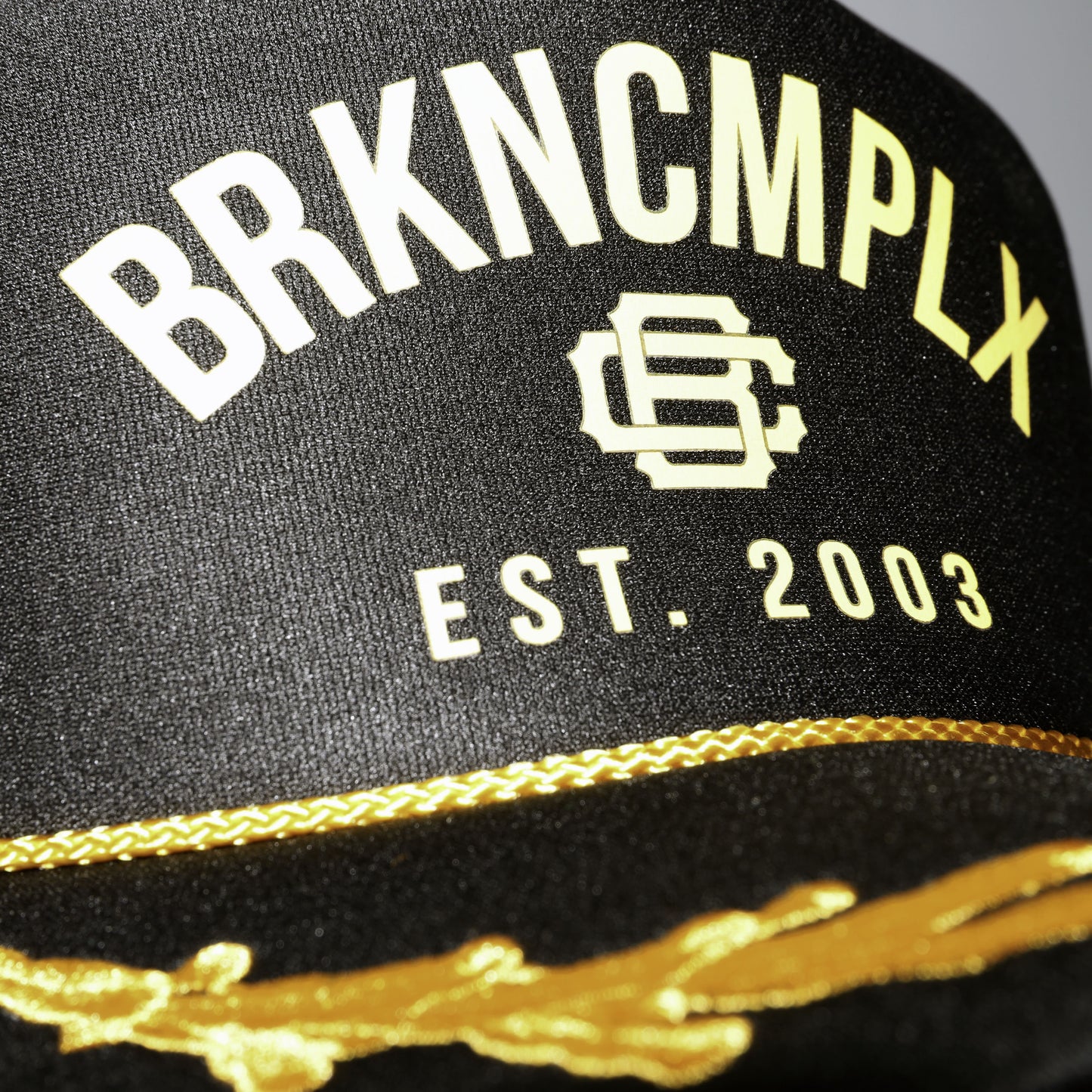 "BRKNCMPLX" Trucker Hat